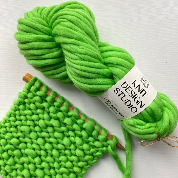 Chunky bright green yarn from Knit Design Studio for knitting colorful green scarf