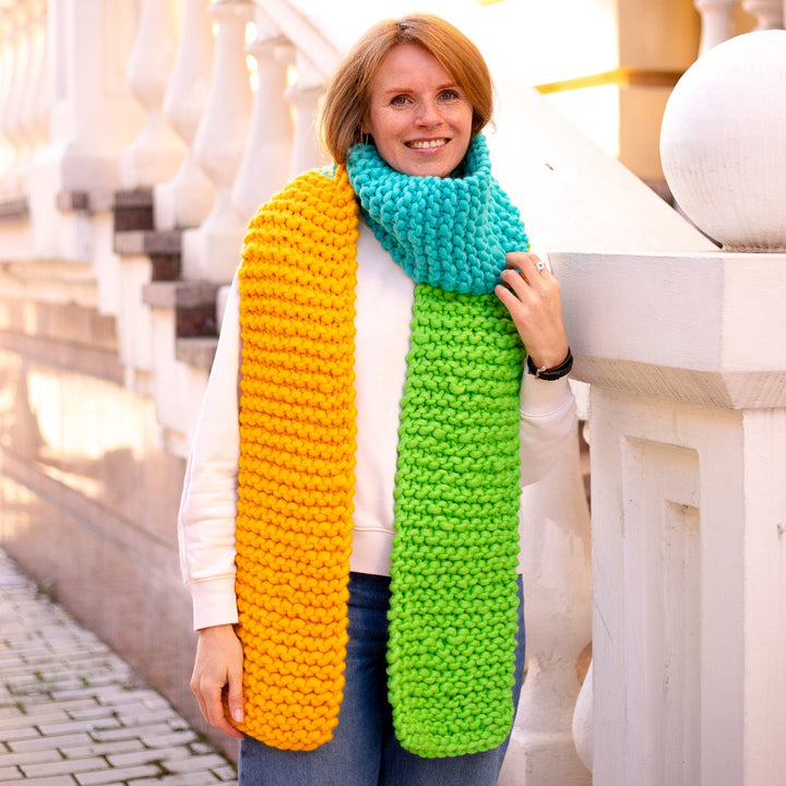 Woman wearing a colorful scarf in an urban setting