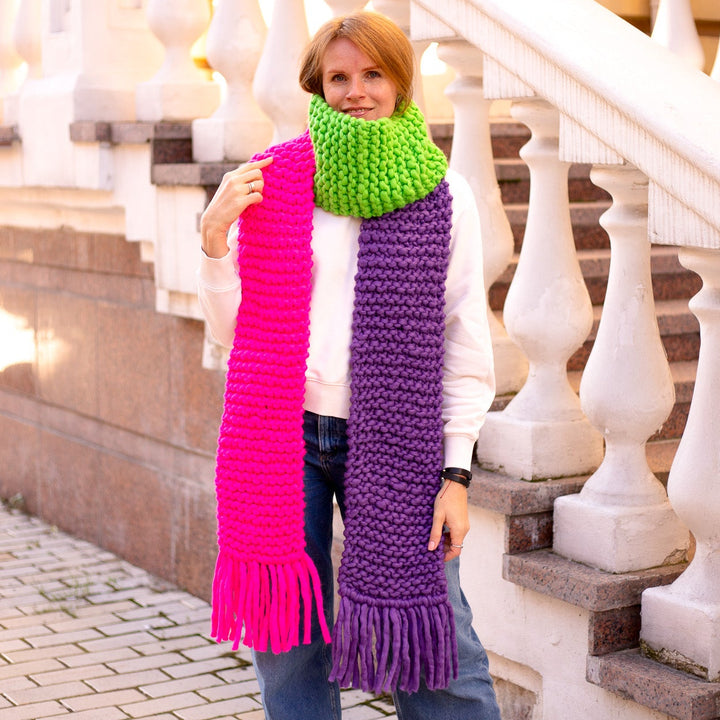 Colorful scarf with fringes in pink, green, and purple, hand knitted from Italian merino wool, perfect for winter.