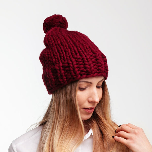 Slouchy pom pom knit hat