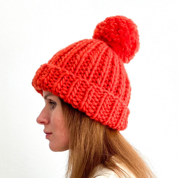 Chunky knit beanie hat with pompom in bright rust SALE